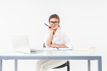 Portrait of a young business woman using laptop at office isolated on white background