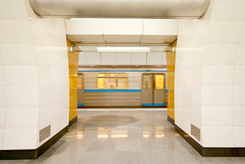 Image of fast traveling train at subway station
