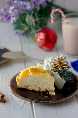 Piece of christmas cake ready to eat on rustic plate.