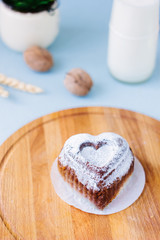 Cake in form of heart as symbol of love.