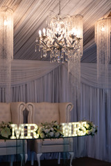 The bride and groom's chairs at the wedding reception