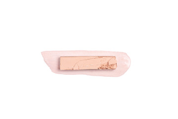 top view of eyeshadow of pink color with stroke on white background