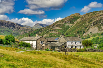 Fototapeta na wymiar A group of traditional whitwashed cottages in the English Lake District.
