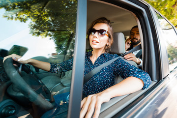 Young woman driving a car