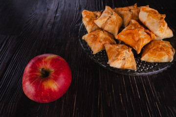 Apple puffs sweet bakery and apple on dark wooden background