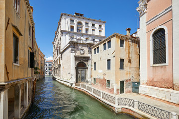 Fototapeta na wymiar Venice, nobody in the canal and in the street, ancient buildings in a sunny summer day in Italy