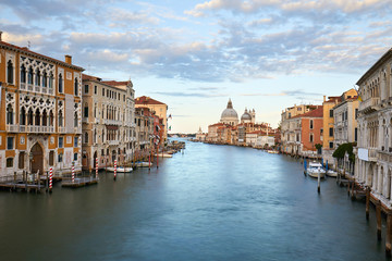 Obraz premium Venice, Grand Canal at dusk, cloudy sky in summer with Saint Mary of Health basilica in Italy