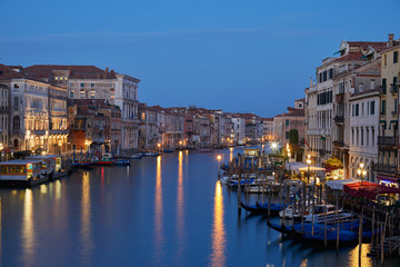 Fototapeta na wymiar Grand Canal in Venice illuminated in the evening in Italy