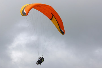 Tandem paraglider flying