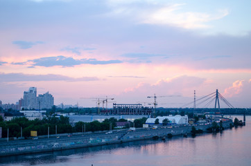 A beautiful pink sunset over the city River. Industrial landscape.