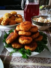 Cutlets lie on a plate on the holiday table