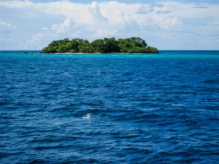 Naklejka premium lonely island in the middle of the sea.
