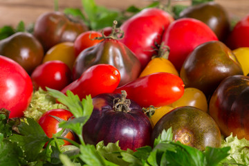 Fresh heirloom tomatoes colorfull background, organic produce