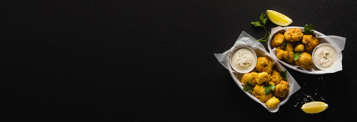 banner of Fried cauliflower in batter with a savory sauce of cashew nuts. healthy vegan fast food. Baked Buffalo Cauliflower 
