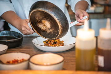 Chef cooking food in kitchen, Chef preparing food, meal, cooking cutting fresh vegetables