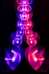 Glowing Christmas garland in the shape of hearts 