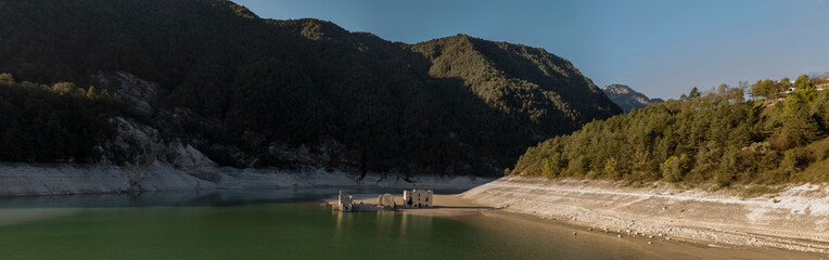Abandoned house on artificial lake bed in the mountains of Friuli, north east Italy.