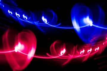 Glowing Christmas garland in the shape of hearts 
