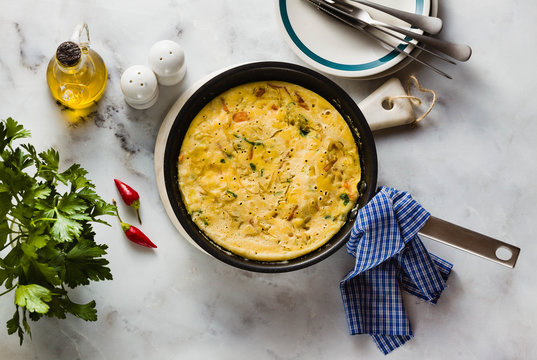 vegan frittata without eggs in a pan on the table. healthy italian appetizer for the whole family or party
