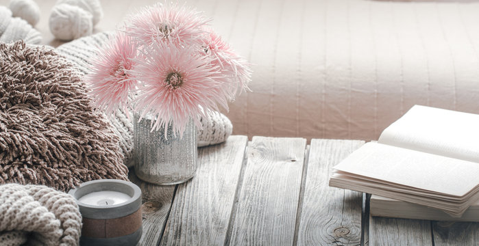 still life from home interior on a wooden background with a candle