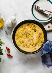 vegan frittata without eggs in a pan on the table. healthy italian appetizer for the whole family or party