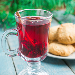 Christmas Mulled Wine with cookies on wooden background