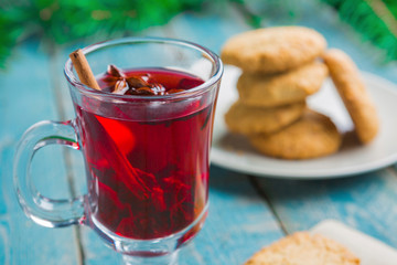 Christmas Mulled Wine with cookies on wooden background