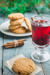 Christmas Mulled Wine with cookies on wooden background