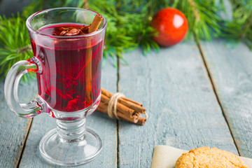 Christmas Mulled Wine with cookies on wooden background
