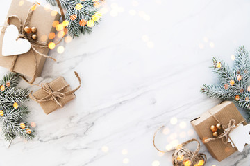 Christmas and New Year holiday background. Xmas greeting card. Christmas gifts on white marble background top view. Flat lay