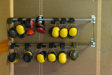 Wall with hearing protection at a shooting gallery