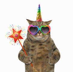 The cat unicorn in glasses is holding a magic wand. White background.