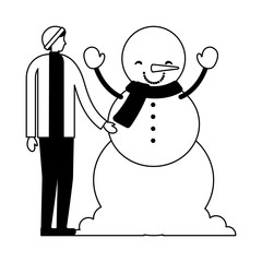 man with winter clothes and snowman