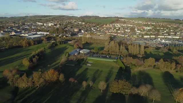 Aerial footage over the town of Bathgate in West Lothian, Scotland. Flying left.