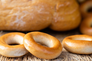 Loaf of white wheat bread, bagels and buns. Close up. Home bakery. Homemade