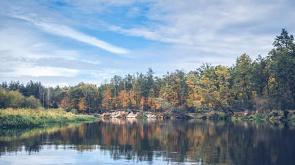 Fototapeta na wymiar Scenic autumn river with trees on the shore.