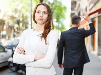 Young brunette in quarrel with boyfriend