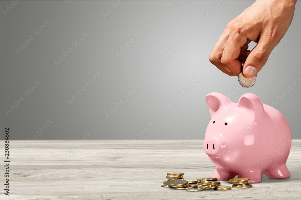 Poster Hand putting coin in piggy bank