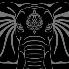Elephant head with a decorative element on a black background
