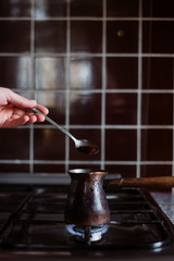  Cooking coffee on a gas stove.