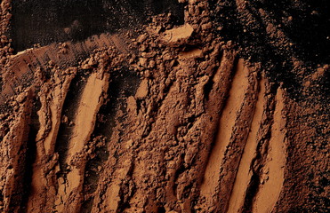 pile cocoa powder pile  on black background, top view