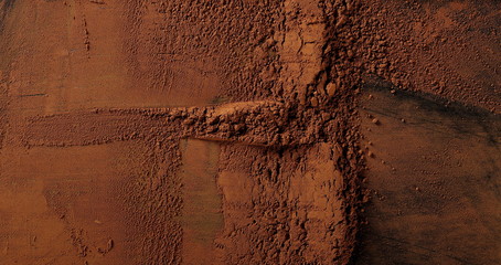 pile cocoa powder pile  on black background, top view