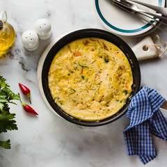 vegan frittata without eggs in a pan on the table. healthy italian appetizer for the whole family or party