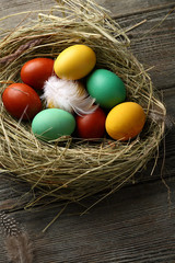 Natural color easter eggs in hay nest