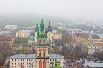 Obraz premium City landscape of Lviv, the tower of Kornyatka Uspenskoy church_