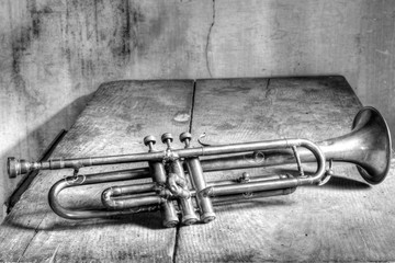 old trumpet on a grey background