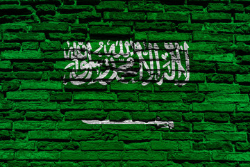 Flag of Saudi Arabia on brick wall