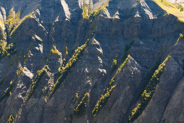 Steep cliff in french alps at summer time