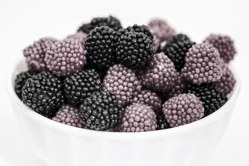 Fruit jelly in the form of berries on a white background.