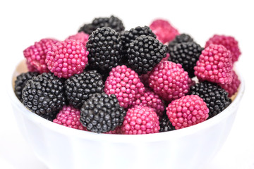 Fruit jelly in the form of berries on a white background.
